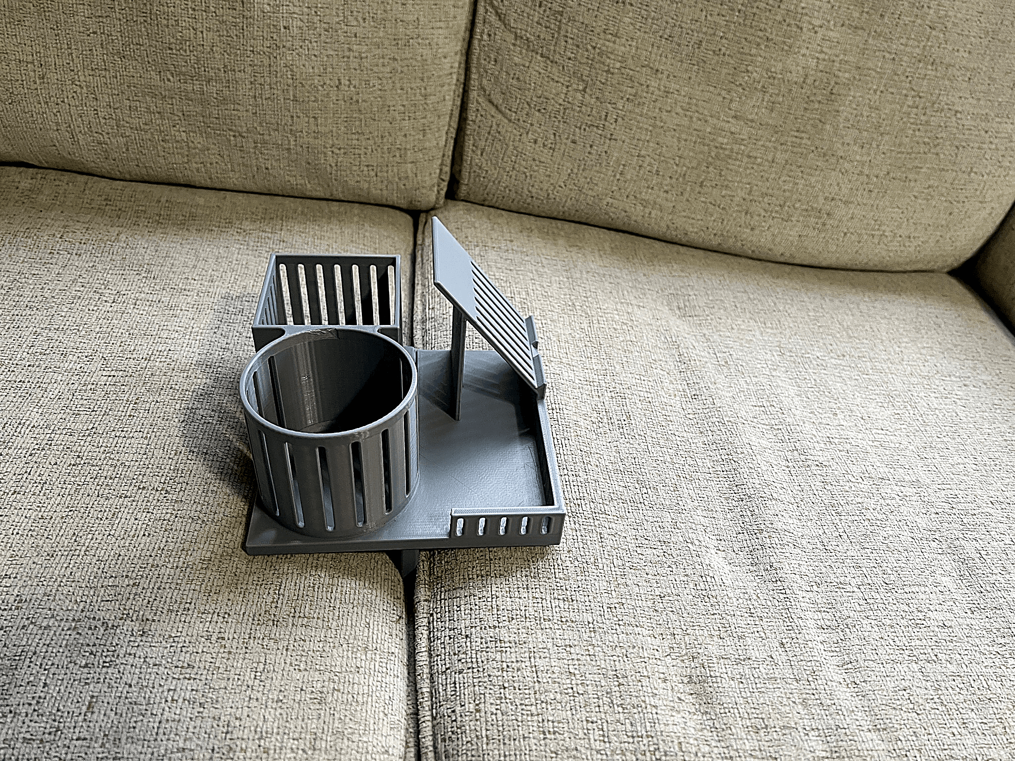 Slim organizer that fits between couch cushions